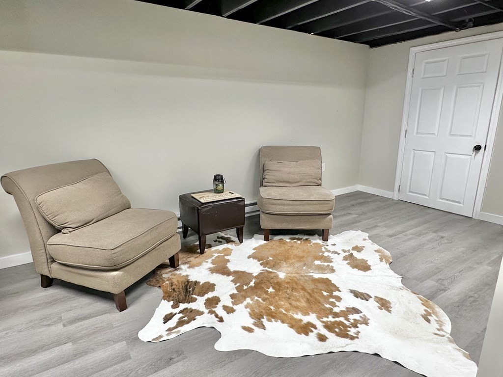 75 Coburn Road Berlin, MA 01503 - Photo 29 of 39 a living room with furniture and a wooden floor