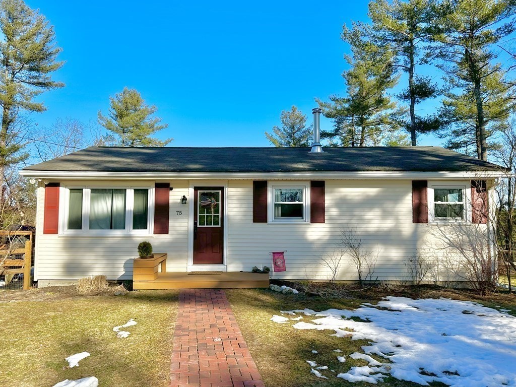75 Coburn Road Berlin, MA 01503 - Photo 3 of 39 a front view of a house with a yard