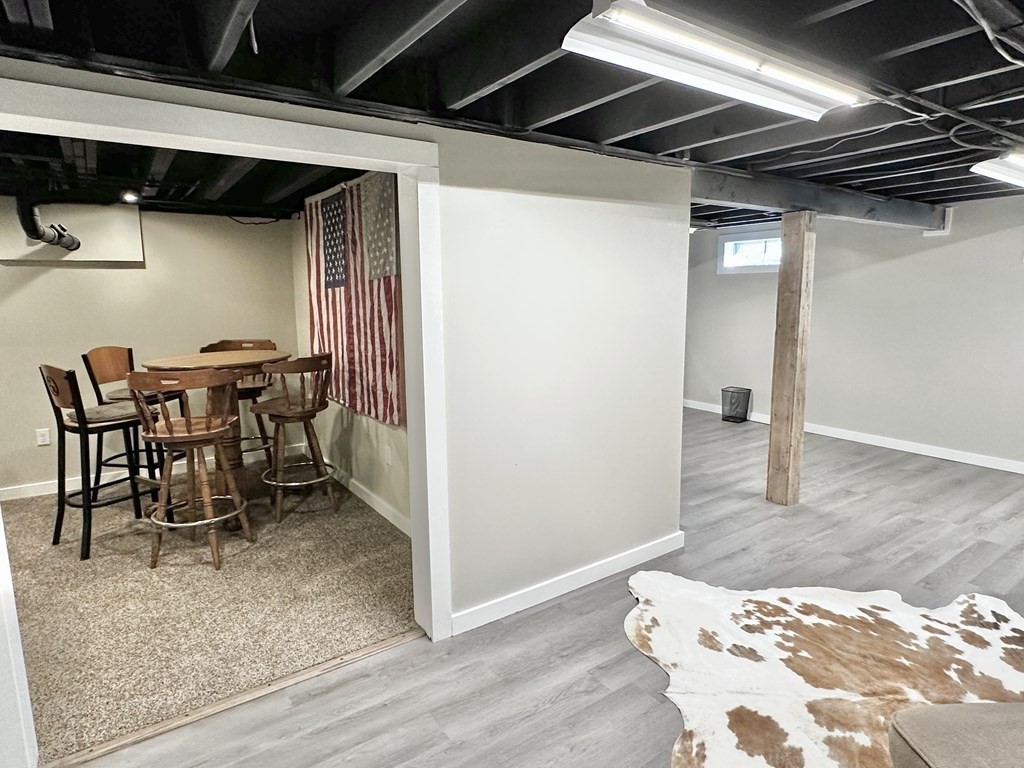 75 Coburn Road Berlin, MA 01503 - Photo 31 of 39 a dining room with furniture and wooden floor