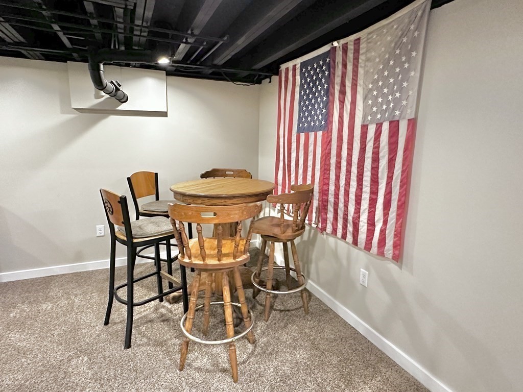 75 Coburn Road Berlin, MA 01503 - Photo 32 of 39 a view of a room that has a table and chairs in it