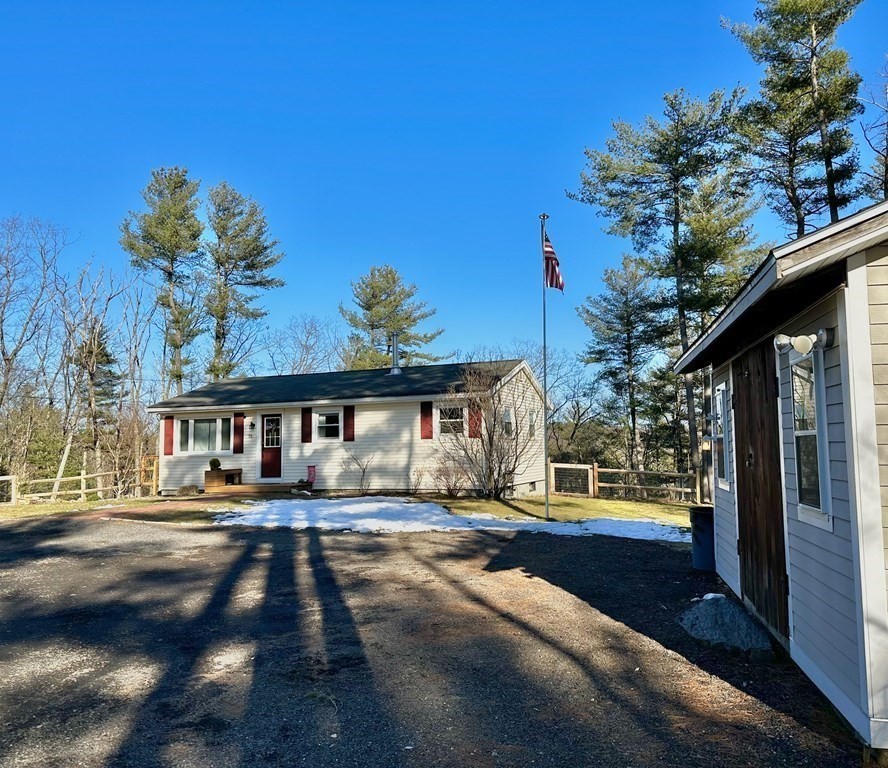 75 Coburn Road Berlin, MA 01503 - Photo 4 of 39 a front view of a house with a yard