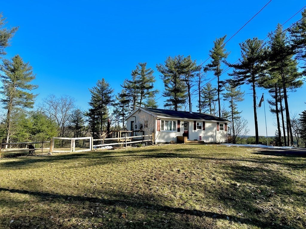 75 Coburn Road Berlin, MA 01503 - Photo 7 of 39 a front view of a house with a yard