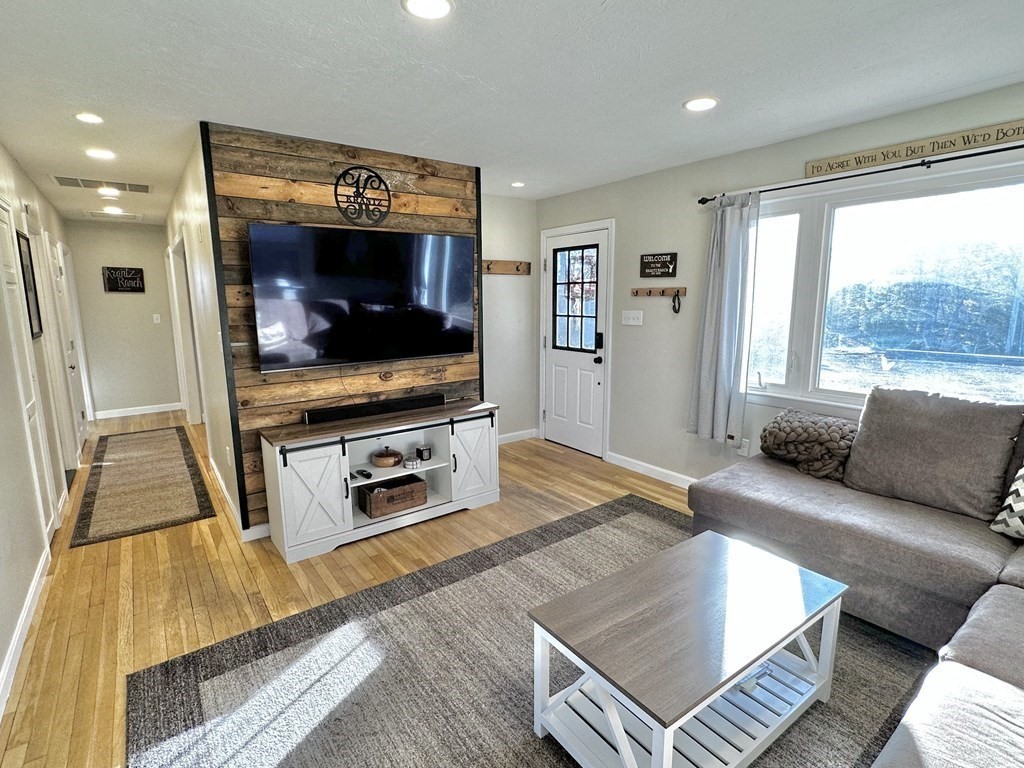 75 Coburn Road Berlin, MA 01503 - Photo 10 of 39 a living room with furniture and a flat screen tv