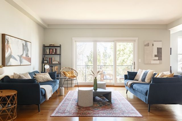 a living room with furniture and a rug