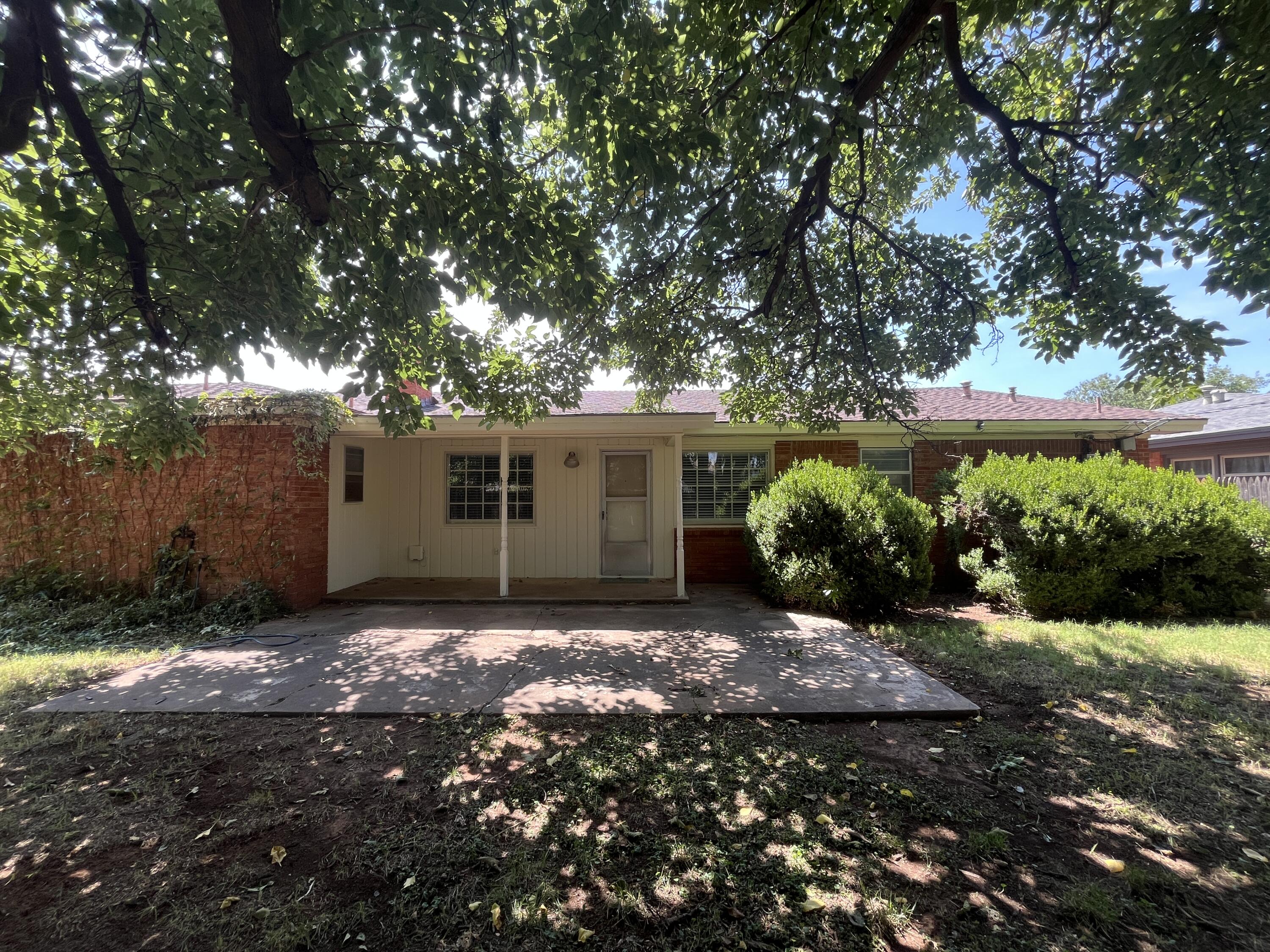 3614 56th Street Lubbock, TX 79413 - Photo 29 of 30 a view of a house with a yard and garage