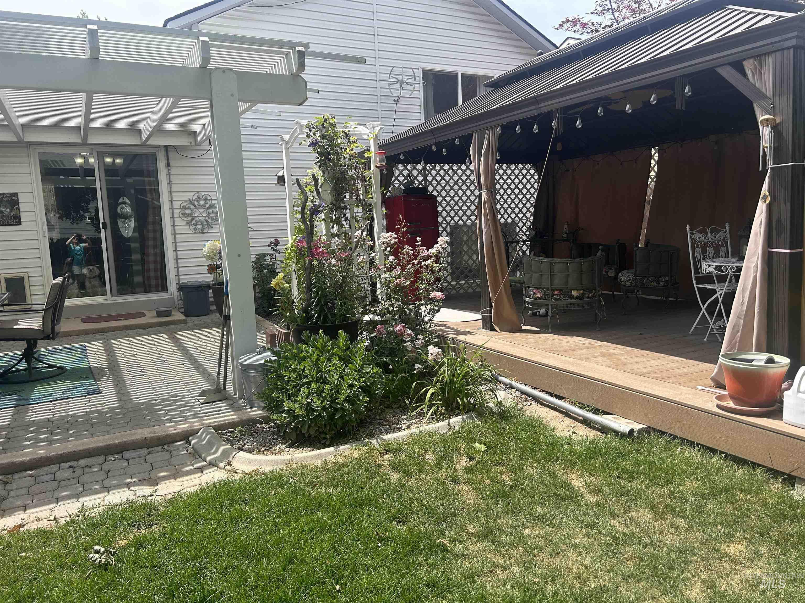 1444 East Doberman Street Meridian, ID 83642 - Photo 22 of 31 Rear exterior featuring a covered pergola, paver patio, and composite deck with a gazebo