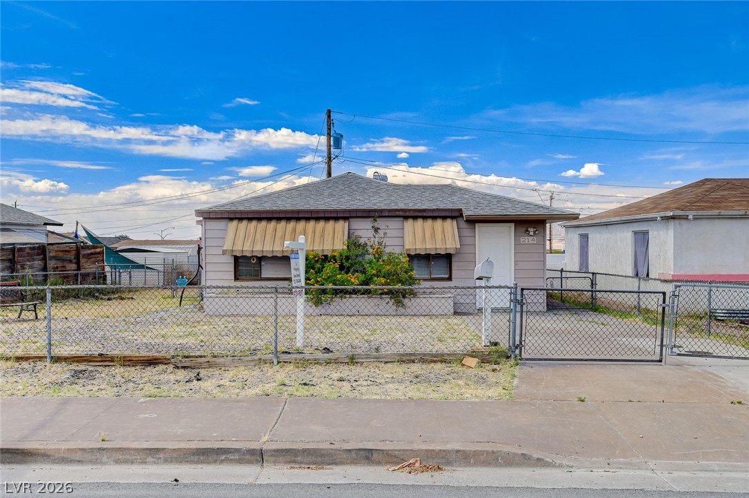 214 West Victory Road Henderson, NV 89015 - Photo 1 of 33 A classic facade with awnings and a gated driveway defines this charming residence.