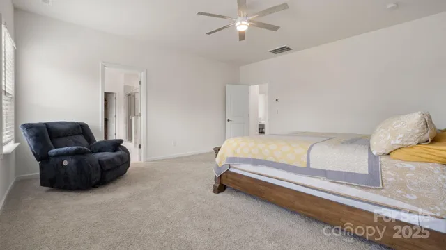 a bathroom with a granite countertop sink and mirror