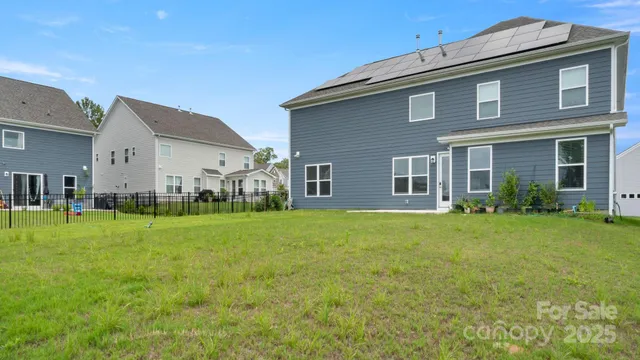 an aerial view of a house with a garden