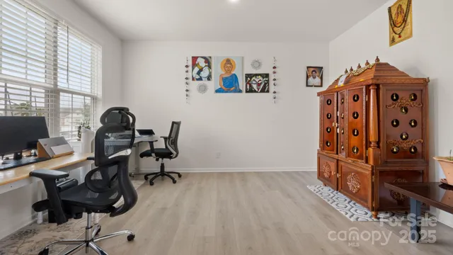 a view of a dining room with furniture and window