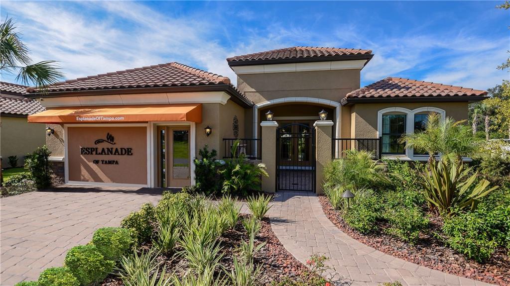 8513 Grand Alberato Road Tampa, FL 33647 - Photo 1 of 1 a front view of a house with garden