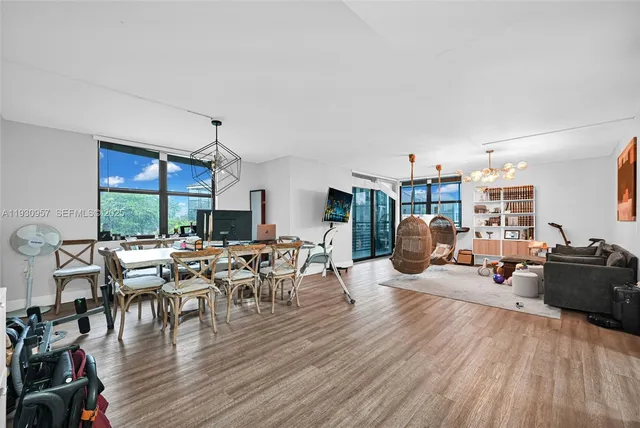 a view of kids room with toys and wooden floor