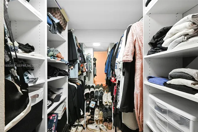 a store room with lots of different colored cloths