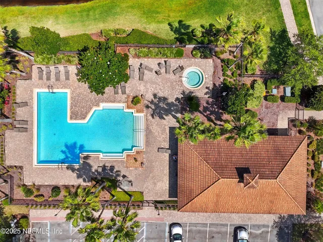 an aerial view of a house with a swimming pool