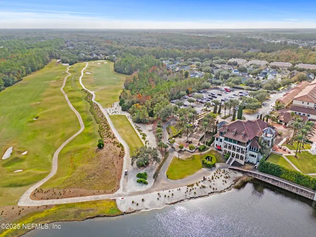 an aerial view of a house with a swimming pool