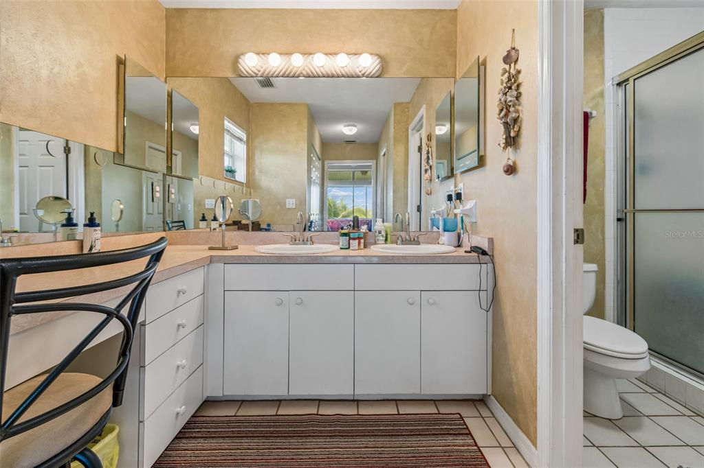 119 Burns Road Terra Ceia, FL 34250 - Photo 43 of 100 a bathroom with a sink a toilet and a mirror