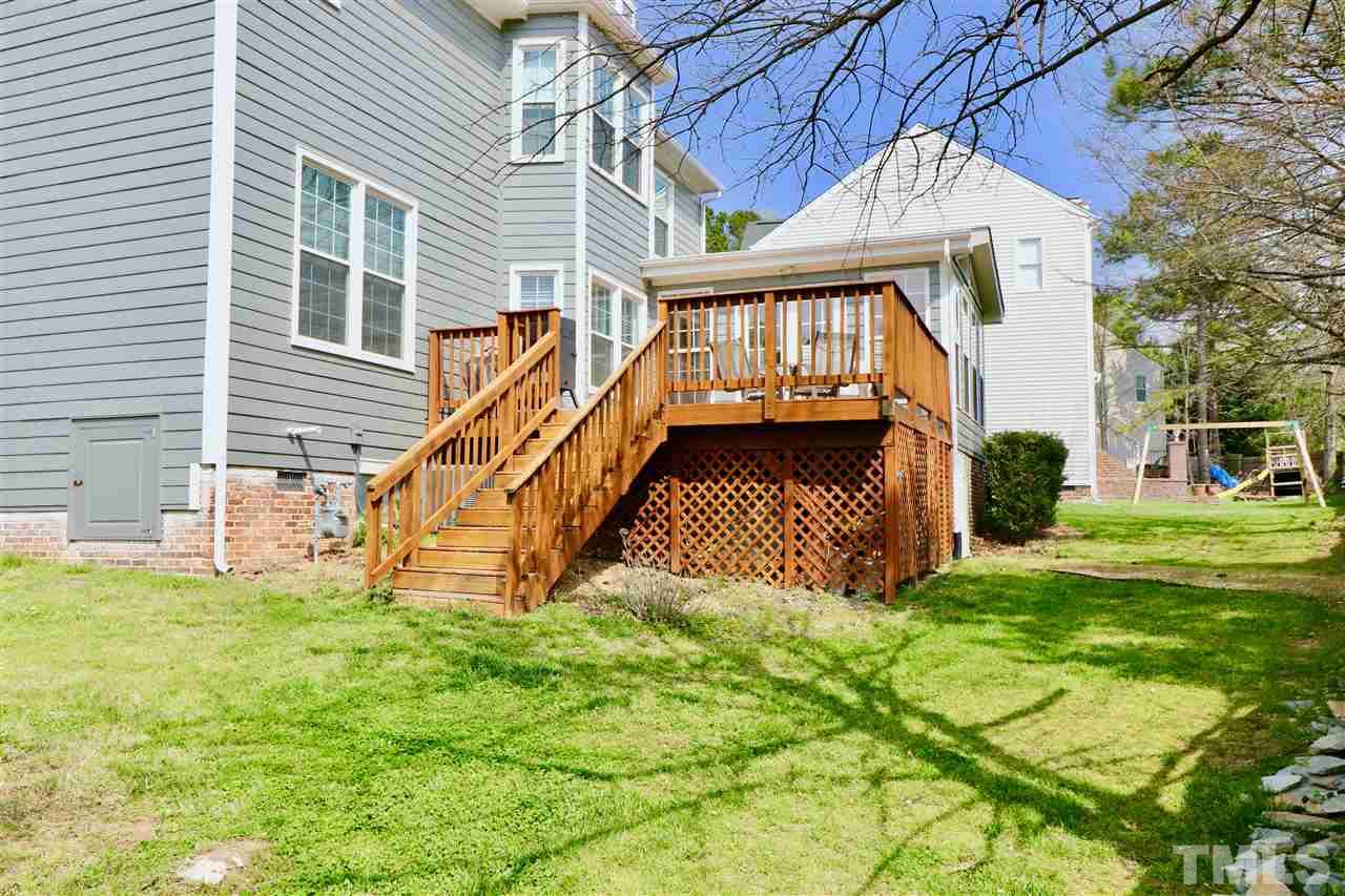 7504 Boscobel Way Raleigh, NC 27615 - Photo 2 of 25 a view of a house with a yard