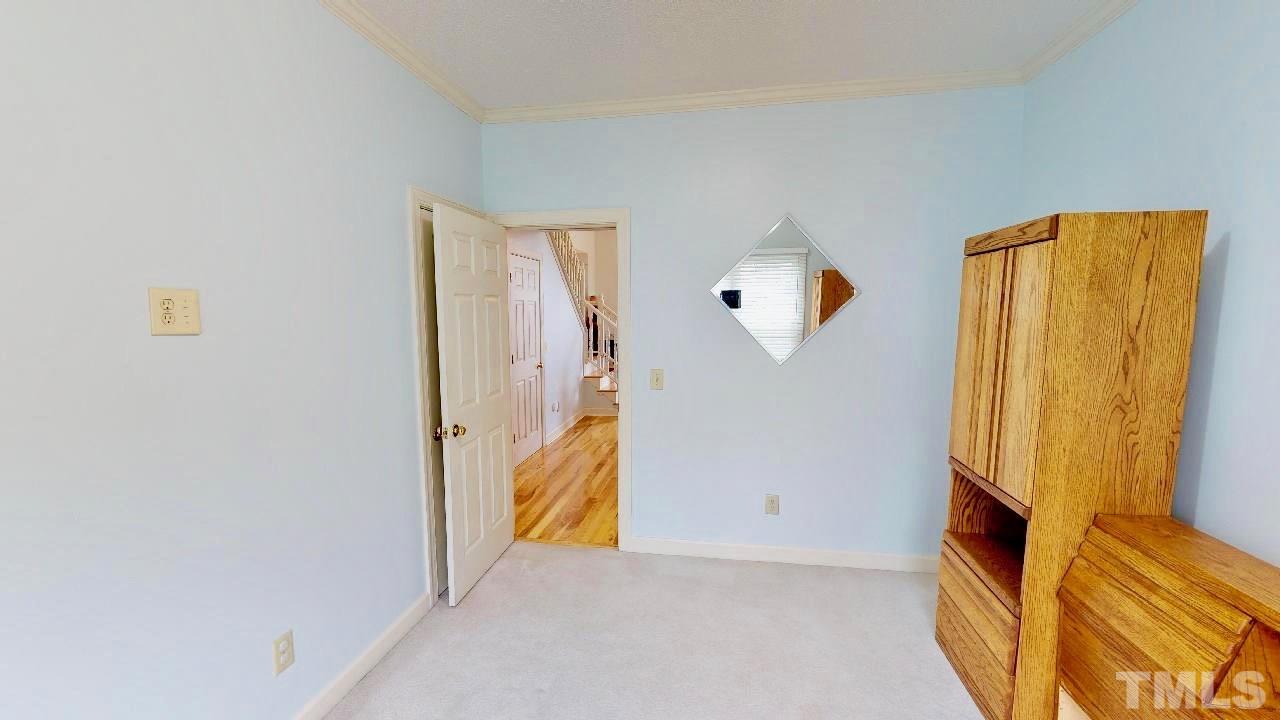 7504 Boscobel Way Raleigh, NC 27615 - Photo 16 of 25 a view of an entryway with wooden floor