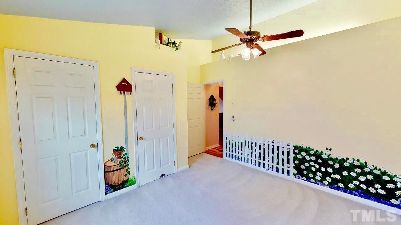7504 Boscobel Way Raleigh, NC 27615 - Photo 19 of 25 a view of a hallway with a dining area
