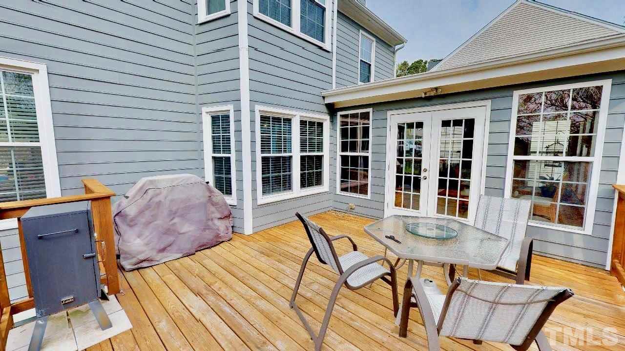 7504 Boscobel Way Raleigh, NC 27615 - Photo 23 of 25 a view of a house with backyard and sitting area