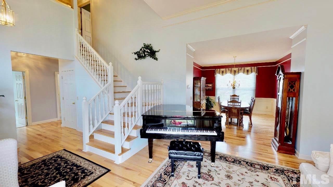 7504 Boscobel Way Raleigh, NC 27615 - Photo 4 of 25 a living room with furniture and a rug