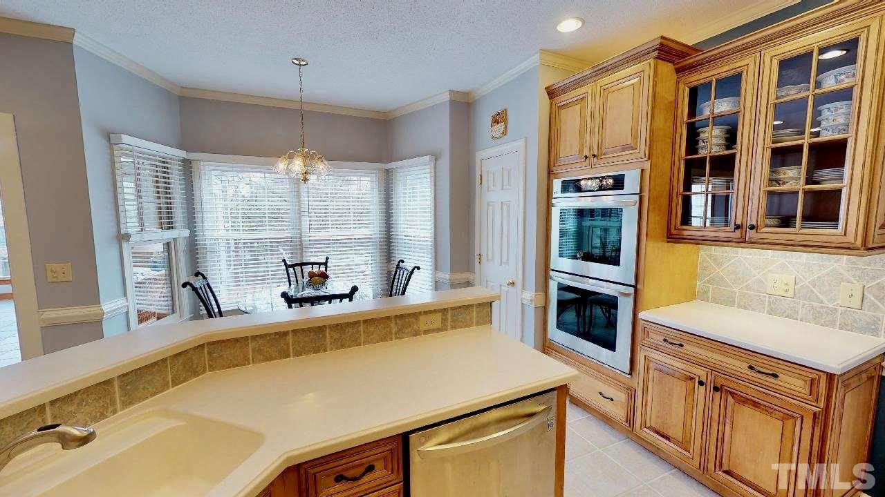 7504 Boscobel Way Raleigh, NC 27615 - Photo 10 of 25 a kitchen that has a lot of windows in it
