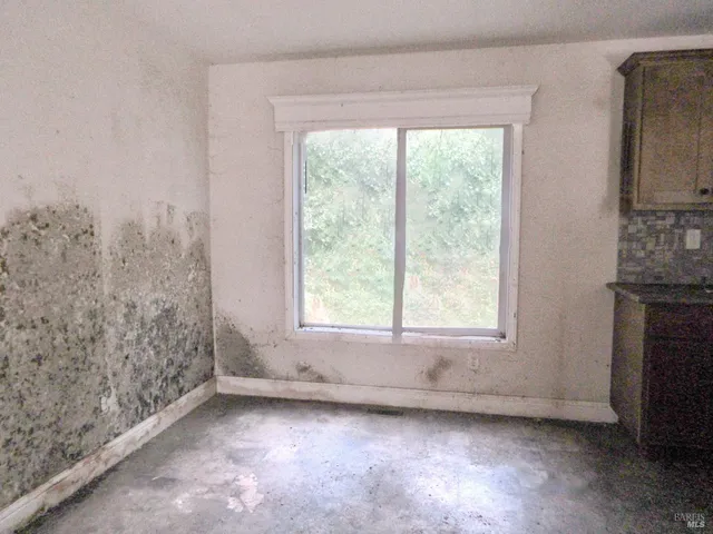 an empty room with windows