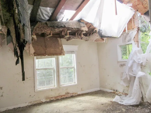 a bathroom with a granite countertop toilet and a shower