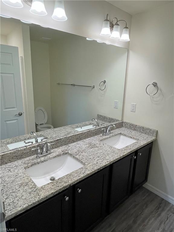 1187 Highlands Road Punta Gorda, FL 33983 - Photo 11 of 21 a bathroom with a granite countertop sink and a mirror
