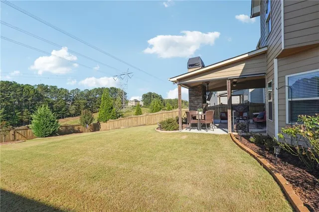 a view of a house with swimming pool and porch