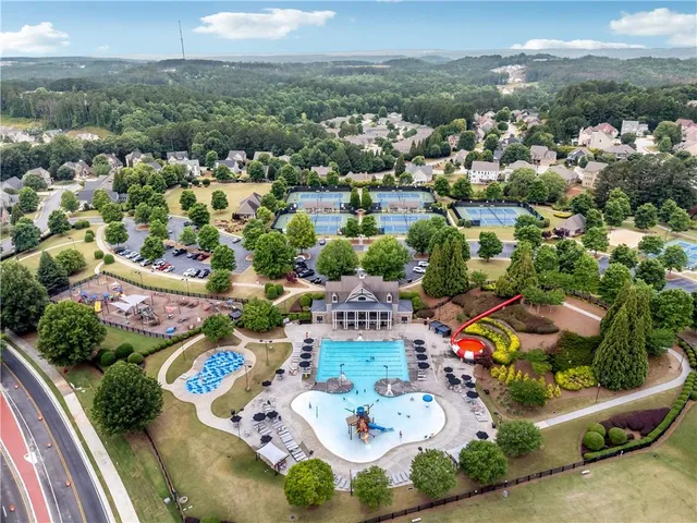 an aerial view of residential houses with outdoor space