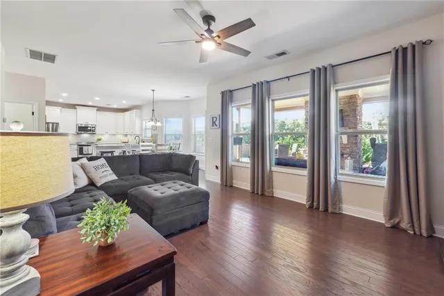 a living room with furniture and a large window
