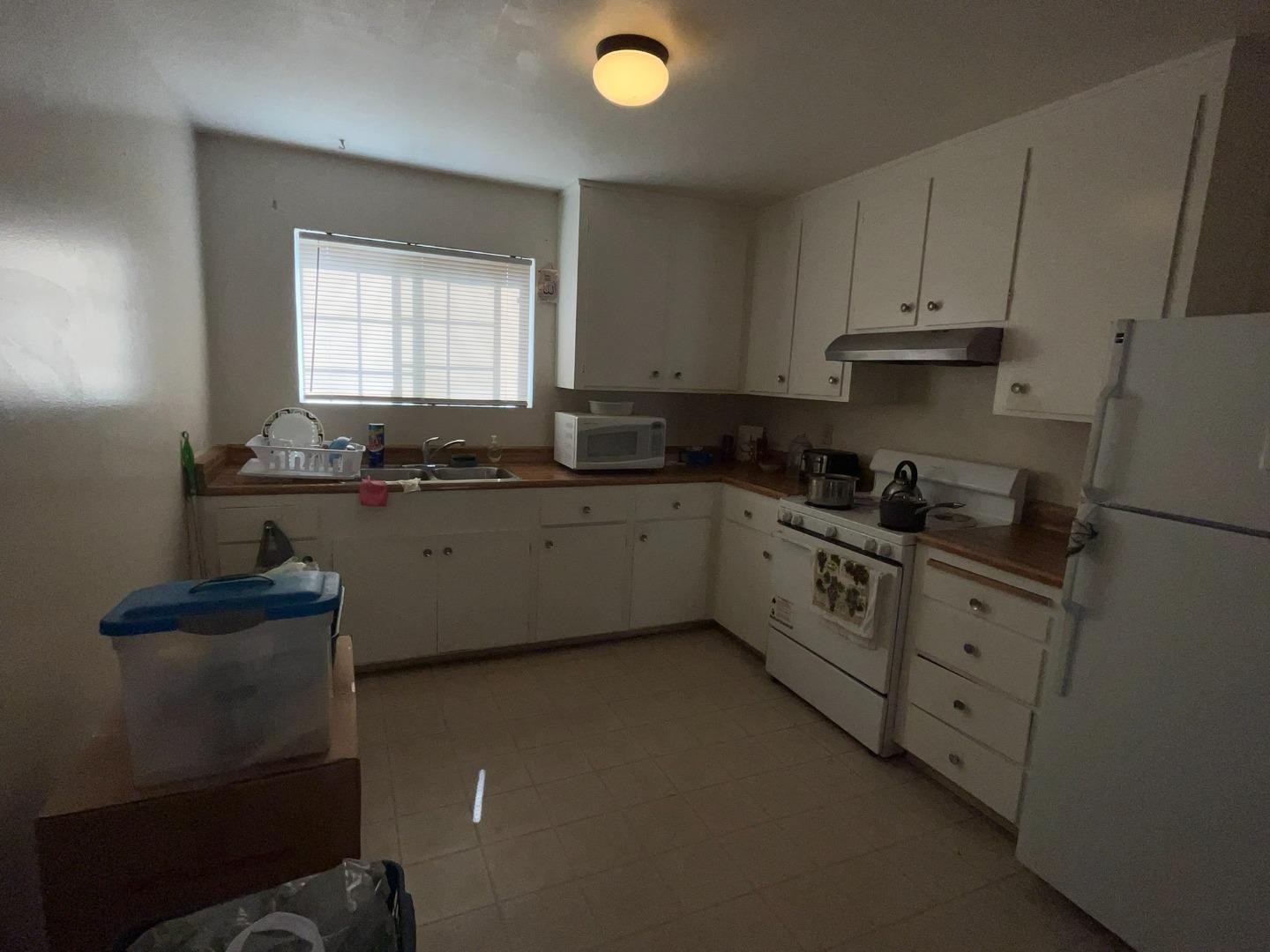 149 Adler Avenue Campbell, CA 95008 - Photo 11 of 12 a kitchen with cabinets appliances a sink and a window