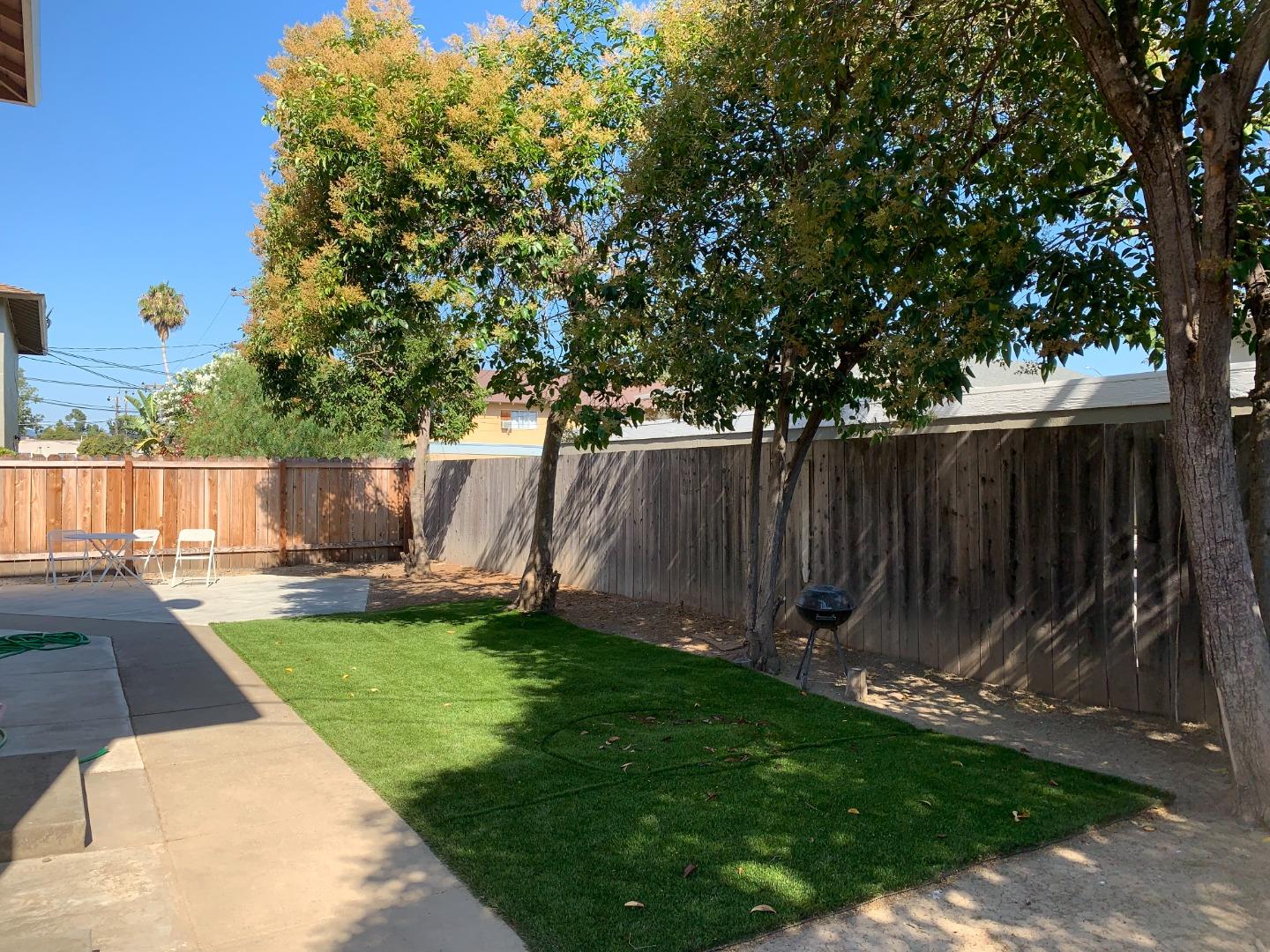 149 Adler Avenue Campbell, CA 95008 - Photo 4 of 12 a view of a backyard with a small cabin and a chair