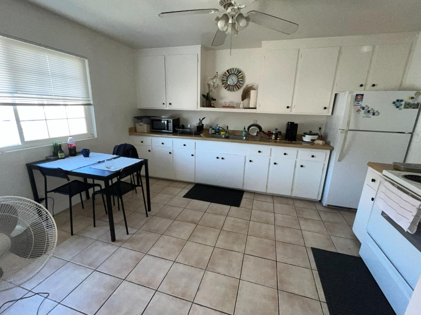 149 Adler Avenue Campbell, CA 95008 - Photo 6 of 12 a kitchen with a stove a sink and a refrigerator