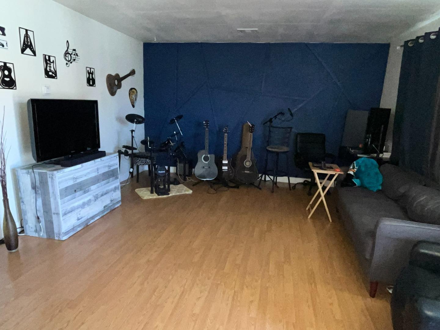149 Adler Avenue Campbell, CA 95008 - Photo 10 of 12 a living room with furniture and a flat screen tv