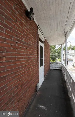 a view of a pathway both side of the house