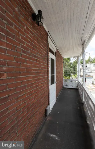 a view of a pathway both side of the house