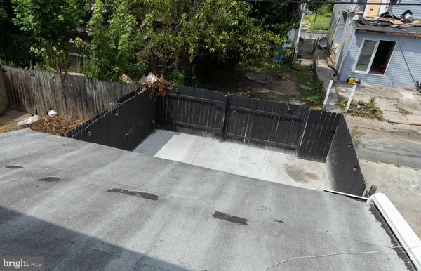a view of balcony with wooden floor