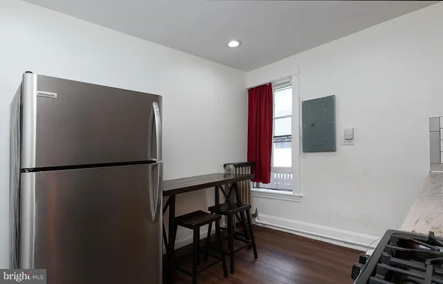 a view of kitchen with furniture and wooden floor