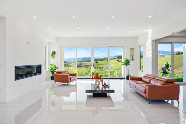 a living room with furniture and a table