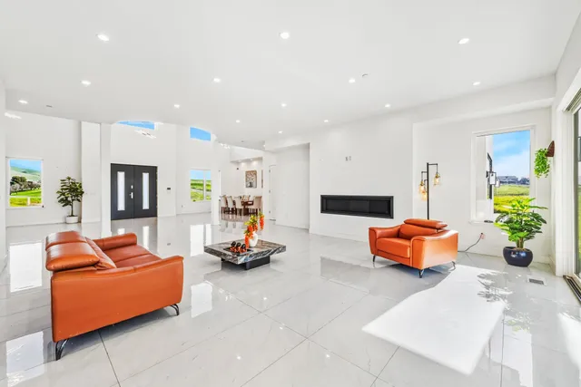 a kitchen with a sink and large window