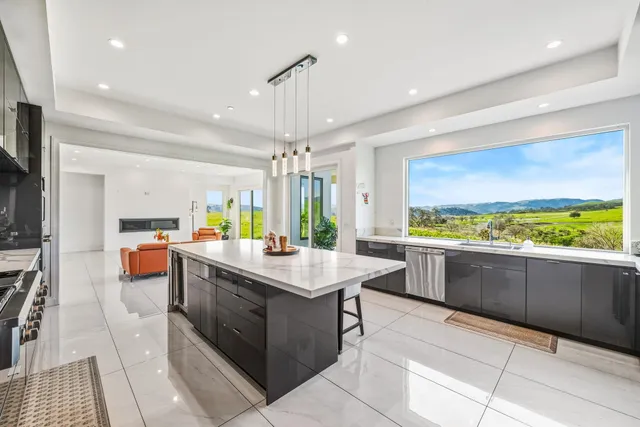 a living room with furniture a window and gym equipment