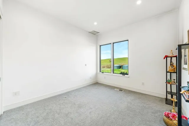 a large bathroom with a large tub and sink