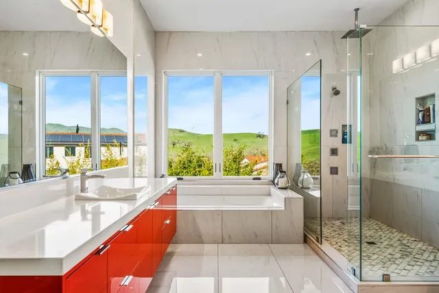 a bed room with a bed and a chair