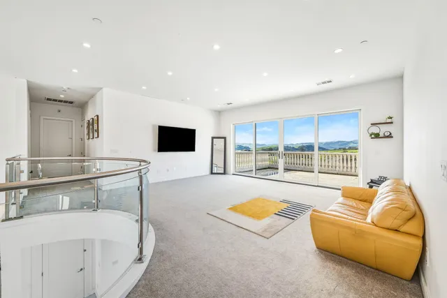 a view of balcony with floor to ceiling window