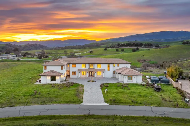 an aerial view of a house with a garden