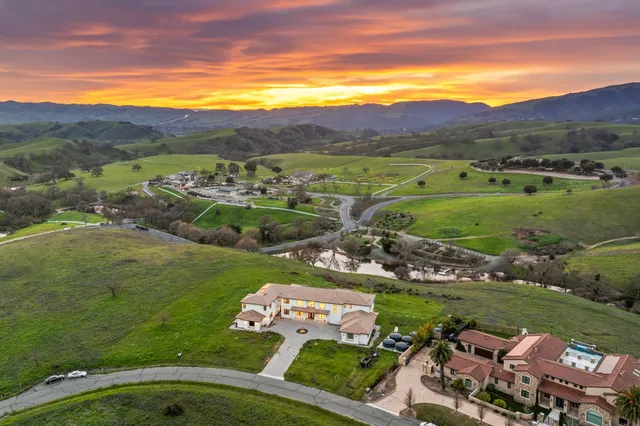 a large white kitchen with a large window