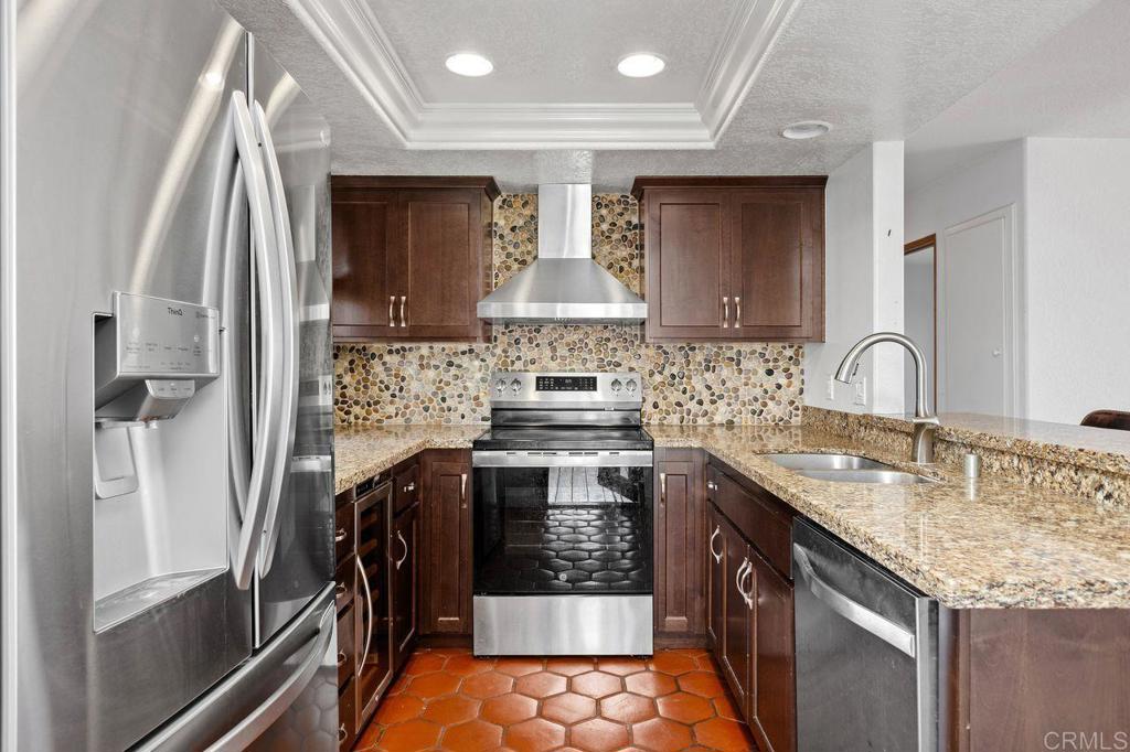 406 Paseo Pacifica Encinitas, CA 92024 - Photo 16 of 53 a kitchen with stainless steel appliances granite countertop a sink stove and refrigerator
