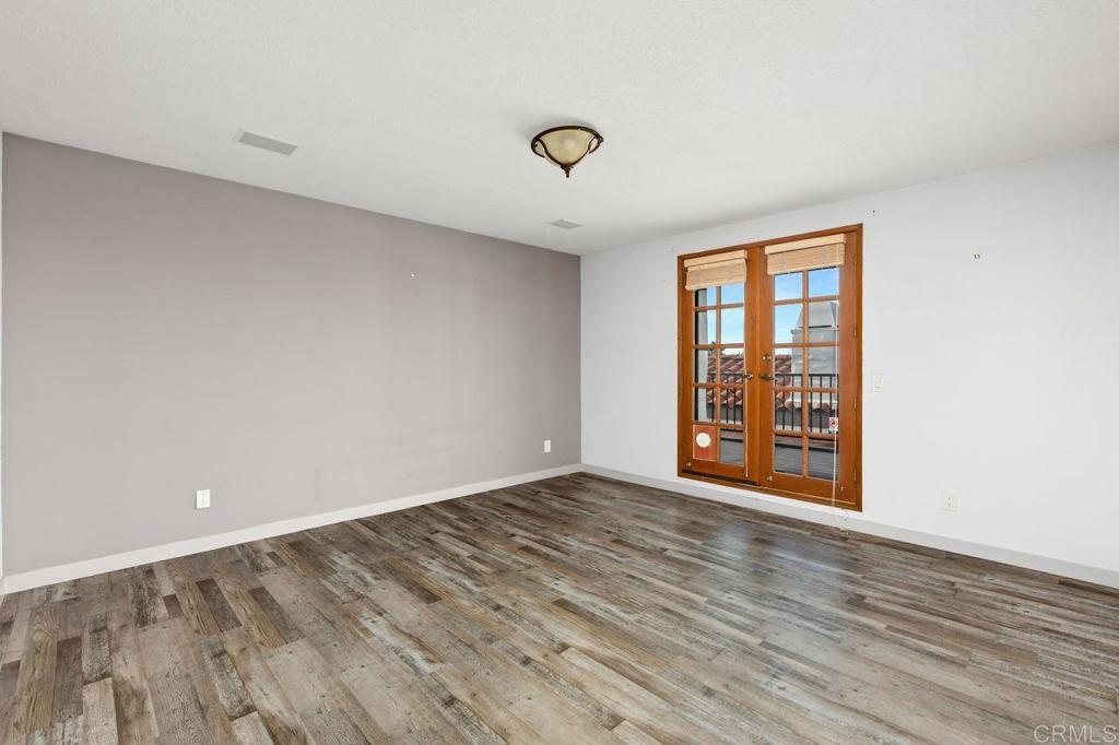 406 Paseo Pacifica Encinitas, CA 92024 - Photo 18 of 53 wooden floor in an empty room with a window